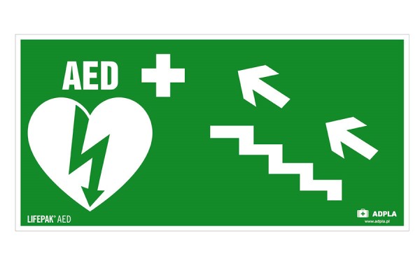 Znak AED w lewo schodami w górę